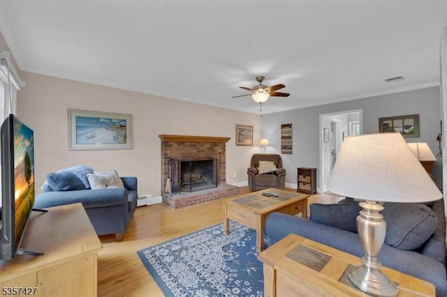 19 Bennington Dr, Mount Olive Twp, NJ 07836 - living area with a brick fireplace, ceiling fan, a baseboard heating unit, light wood-style floors, and baseboards
