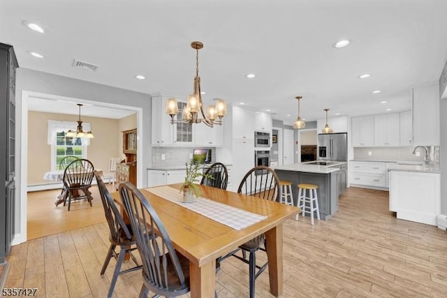 19 Bennington Dr, Mount Olive Twp, NJ 07836 - dining room featuring a chandelier, light wood-style flooring, recessed lighting, and baseboard heating