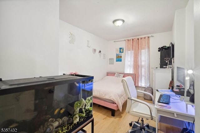 234 Lt Glenn Zamorski Dr, Elizabeth City, NJ 07206 - bedroom with wood finished floors and an office area