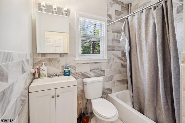 234 Lt Glenn Zamorski Dr, Elizabeth City, NJ 07206 - bathroom with tile walls, toilet, vanity, and shower / tub combo with curtain