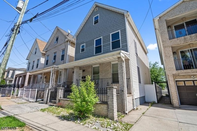 234 Lt Glenn Zamorski Dr, Elizabeth City, NJ 07206 - view of front of home featuring covered porch, a gate, and a fenced front yard