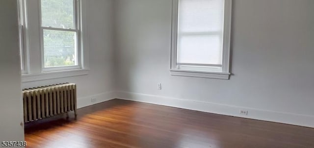 31 Wyckoff Ave, Wyckoff Twp, NJ 07446 - empty room with radiator, wood finished floors, and baseboards