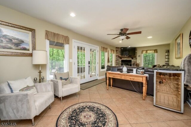49 Sliker Rd, Lebanon Twp, NJ 08826 - living room with a ceiling fan, french doors, light tile patterned floors, a large fireplace, and recessed lighting
