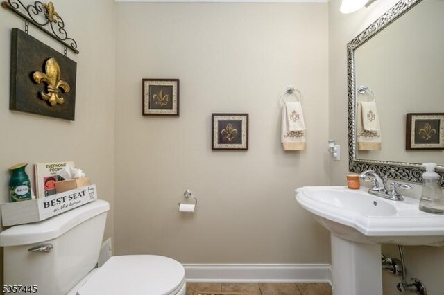 49 Sliker Rd, Lebanon Twp, NJ 08826 - bathroom with baseboards, toilet, and tile patterned flooring