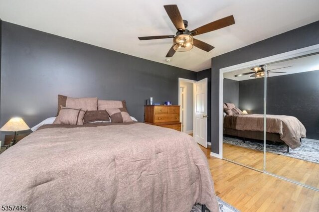 49 Sliker Rd, Lebanon Twp, NJ 08826 - bedroom with light wood-style flooring, a closet, a ceiling fan, and baseboards