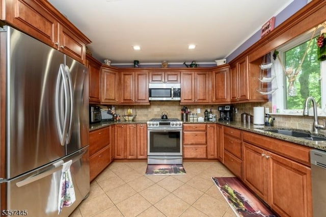 49 Sliker Rd, Lebanon Twp, NJ 08826 - kitchen featuring stainless steel appliances, a sink, brown cabinets, and dark stone countertops