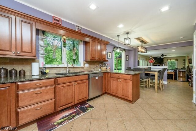 49 Sliker Rd, Lebanon Twp, NJ 08826 - kitchen with dishwasher, a sink, a peninsula, decorative backsplash, and healthy amount of natural light
