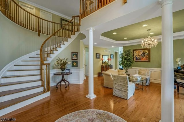 9 Corda Ln, Warren Twp, NJ 07059 - living area with ornate columns, wood finished floors, stairs, ornamental molding, and recessed lighting