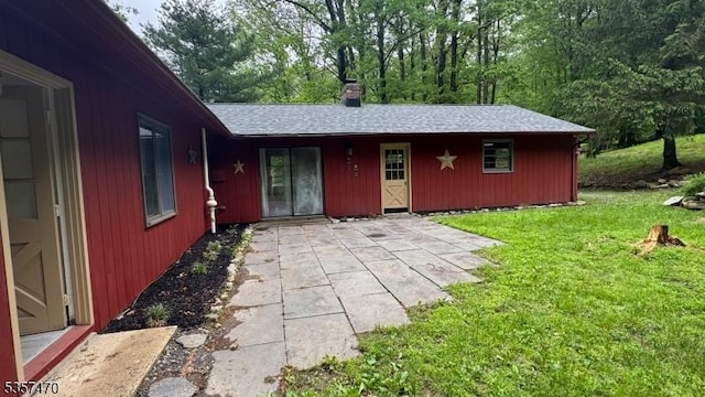 10 Deerpath Rd, Lebanon Twp, NJ 07830 - rear view of property with a yard, a patio, and a chimney