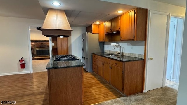 10 Deerpath Rd, Lebanon Twp, NJ 07830 - kitchen featuring a sink, wood finished floors, appliances with stainless steel finishes, brown cabinets, and recessed lighting