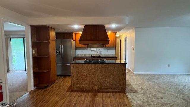 10 Deerpath Rd, Lebanon Twp, NJ 07830 - kitchen with stainless steel refrigerator with ice dispenser, custom range hood, dark countertops, a sink, and black gas cooktop