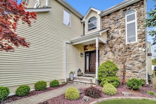 7 Rine Rd, Hillsborough Twp, NJ 08844 - doorway to property featuring stone siding