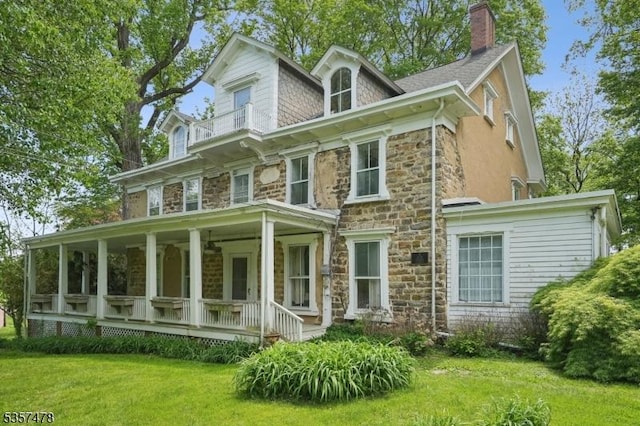 19 E Mill Rd, Washington Twp, NJ 07853 - view of front of property featuring stone siding, covered porch, a front yard, and a chimney