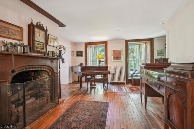19 E Mill Rd, Washington Twp, NJ 07853 - sitting room featuring radiator, ornamental molding, hardwood / wood-style floors, and a fireplace