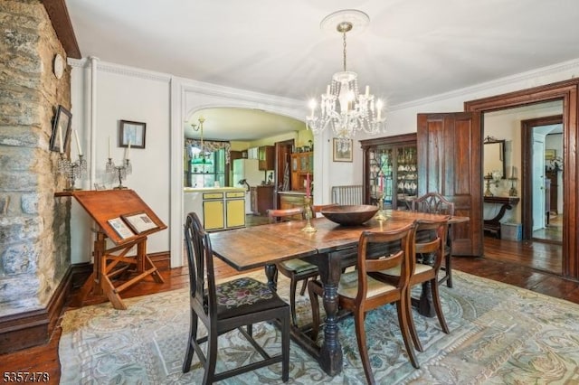 19 E Mill Rd, Washington Twp, NJ 07853 - dining room with a chandelier, arched walkways, wood finished floors, and ornamental molding