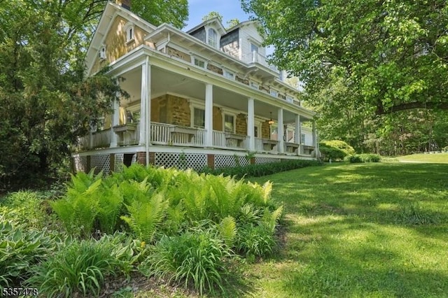 19 E Mill Rd, Washington Twp, NJ 07853 - view of property exterior featuring a porch, a lawn, and a chimney
