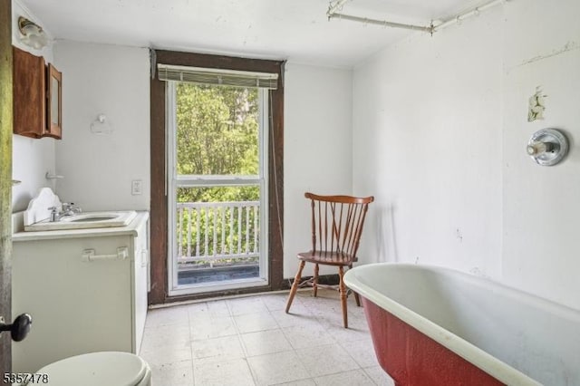 19 E Mill Rd, Washington Twp, NJ 07853 - bathroom featuring a soaking tub, toilet, tile patterned floors, and vanity