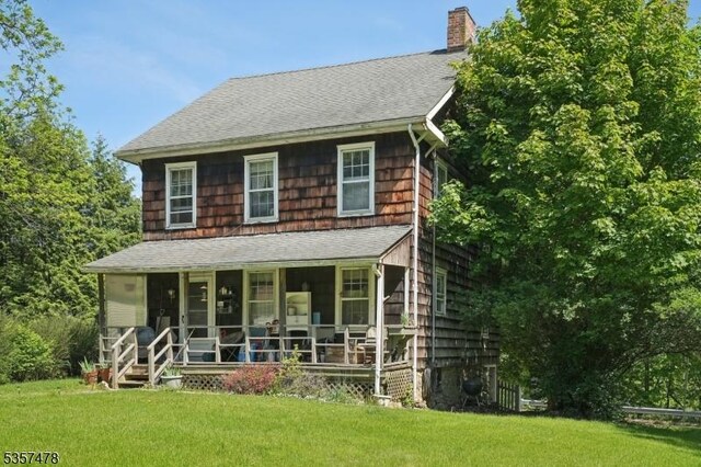 19 E Mill Rd, Washington Twp, NJ 07853 - view of front of home with a chimney, a shingled roof, and a front yard