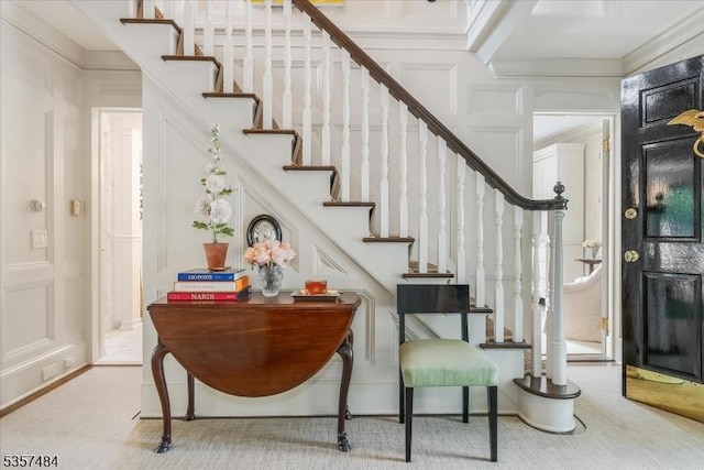 167 Lake End Rd, Rockaway Twp, NJ 07435 - stairway featuring a decorative wall, crown molding, and carpet flooring