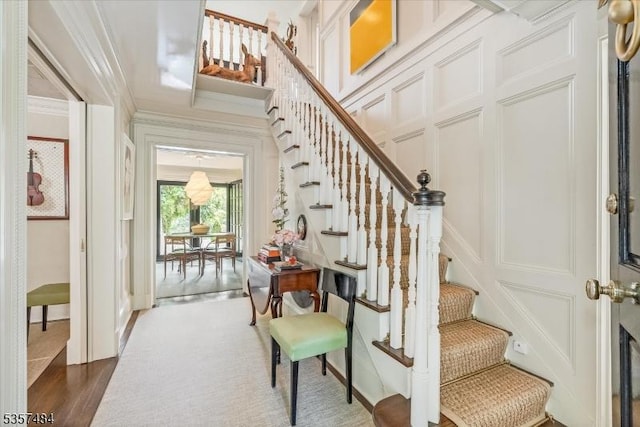 167 Lake End Rd, Rockaway Twp, NJ 07435 - staircase featuring a decorative wall, crown molding, and wood finished floors