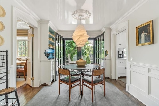167 Lake End Rd, Rockaway Twp, NJ 07435 - dining space with ornamental molding, dark wood-type flooring, a wainscoted wall, and a decorative wall