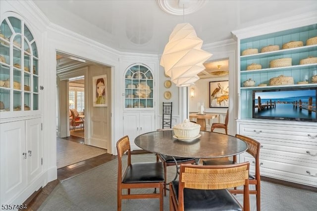 167 Lake End Rd, Rockaway Twp, NJ 07435 - dining space with ornamental molding and dark wood-style flooring
