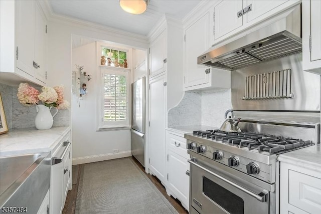 167 Lake End Rd, Rockaway Twp, NJ 07435 - kitchen with appliances with stainless steel finishes, under cabinet range hood, white cabinetry, tasteful backsplash, and baseboards