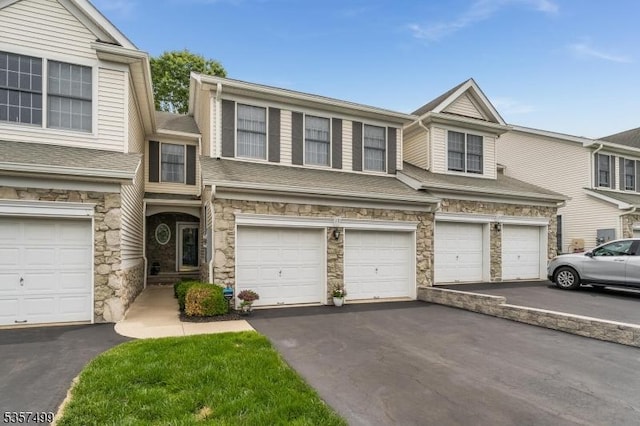 15 Pinehurst Cir, Clinton Twp, NJ 08801 - townhome / multi-family property with stone siding, driveway, a garage, and roof with shingles