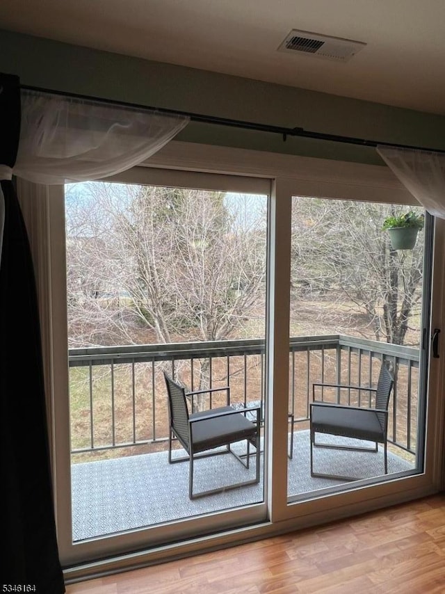 doorway to outside featuring wood finished floors