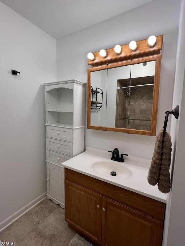 full bathroom featuring vanity and baseboards