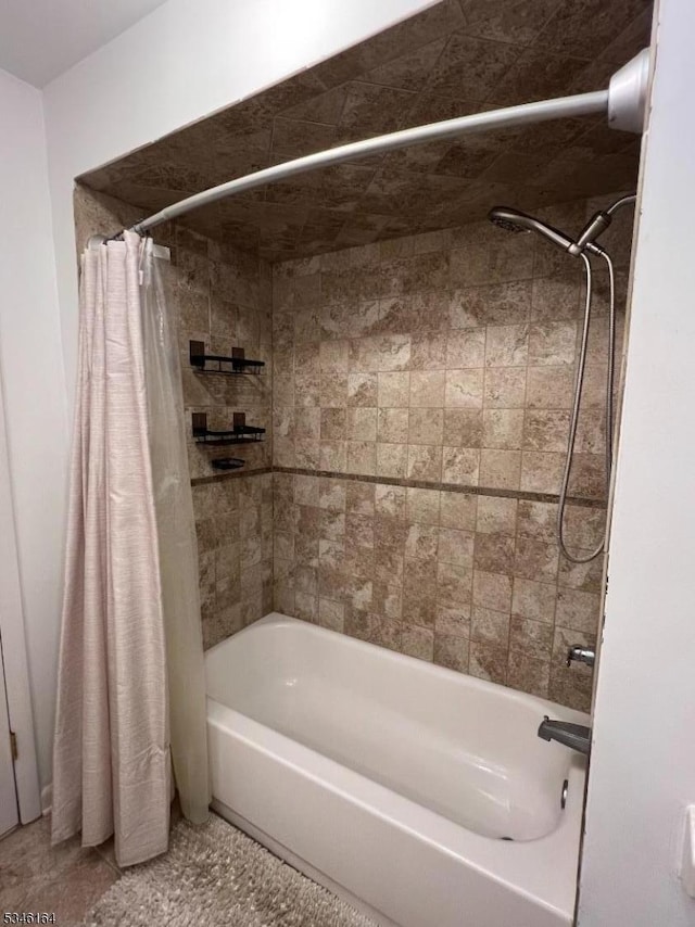 bathroom with shower / bath combo