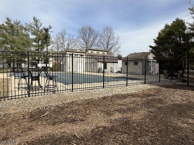 community pool featuring fence