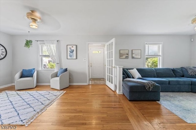 living room with light wood-style floors and baseboards
