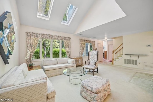 69 Village Dr, Bernards Twp, NJ 07920 - carpeted living room with high vaulted ceiling, stairway, and a skylight