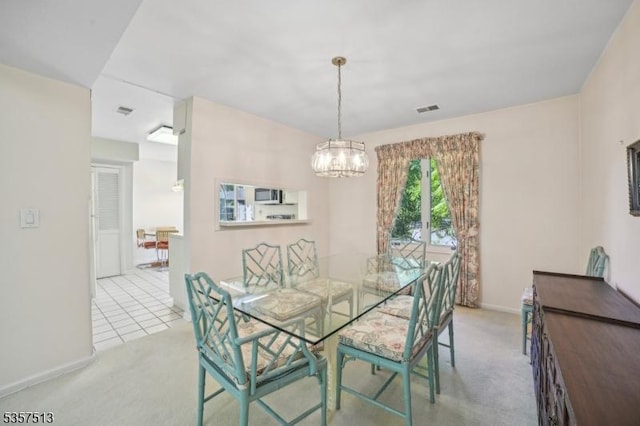 69 Village Dr, Bernards Twp, NJ 07920 - dining room with light carpet, a chandelier, and baseboards