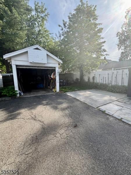 18 Park Dr N, West Orange Twp, NJ 07052 - detached garage featuring fence