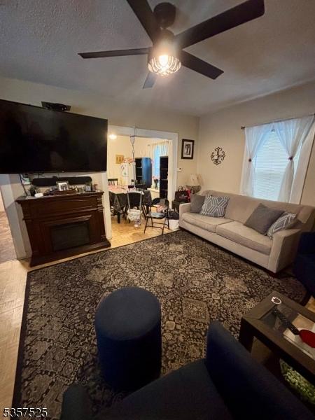 18 Park Dr N, West Orange Twp, NJ 07052 - living room with a ceiling fan and wood finished floors
