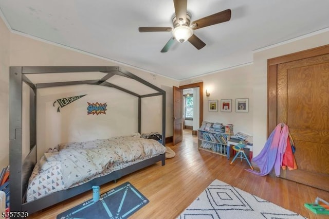 bedroom with wood finished floors and ceiling fan