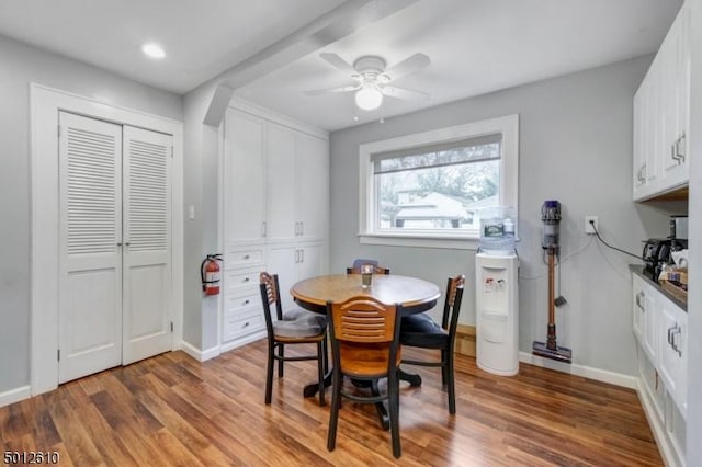 dining space featuring wood finished floors, ceiling fan, baseboards, and recessed lighting