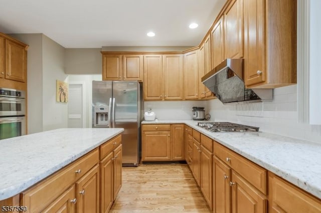102 Independence Dr, Bernards Twp, NJ 07920 - kitchen with stainless steel appliances, exhaust hood, light wood finished floors, light stone counters, and recessed lighting