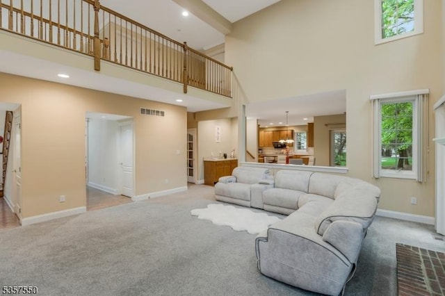 102 Independence Dr, Bernards Twp, NJ 07920 - living area with light carpet, a high ceiling, baseboards, and recessed lighting