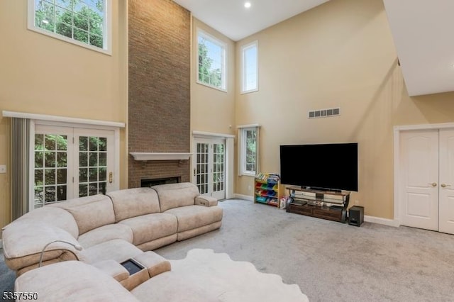 102 Independence Dr, Bernards Twp, NJ 07920 - living room with a towering ceiling, carpet floors, baseboards, and a fireplace