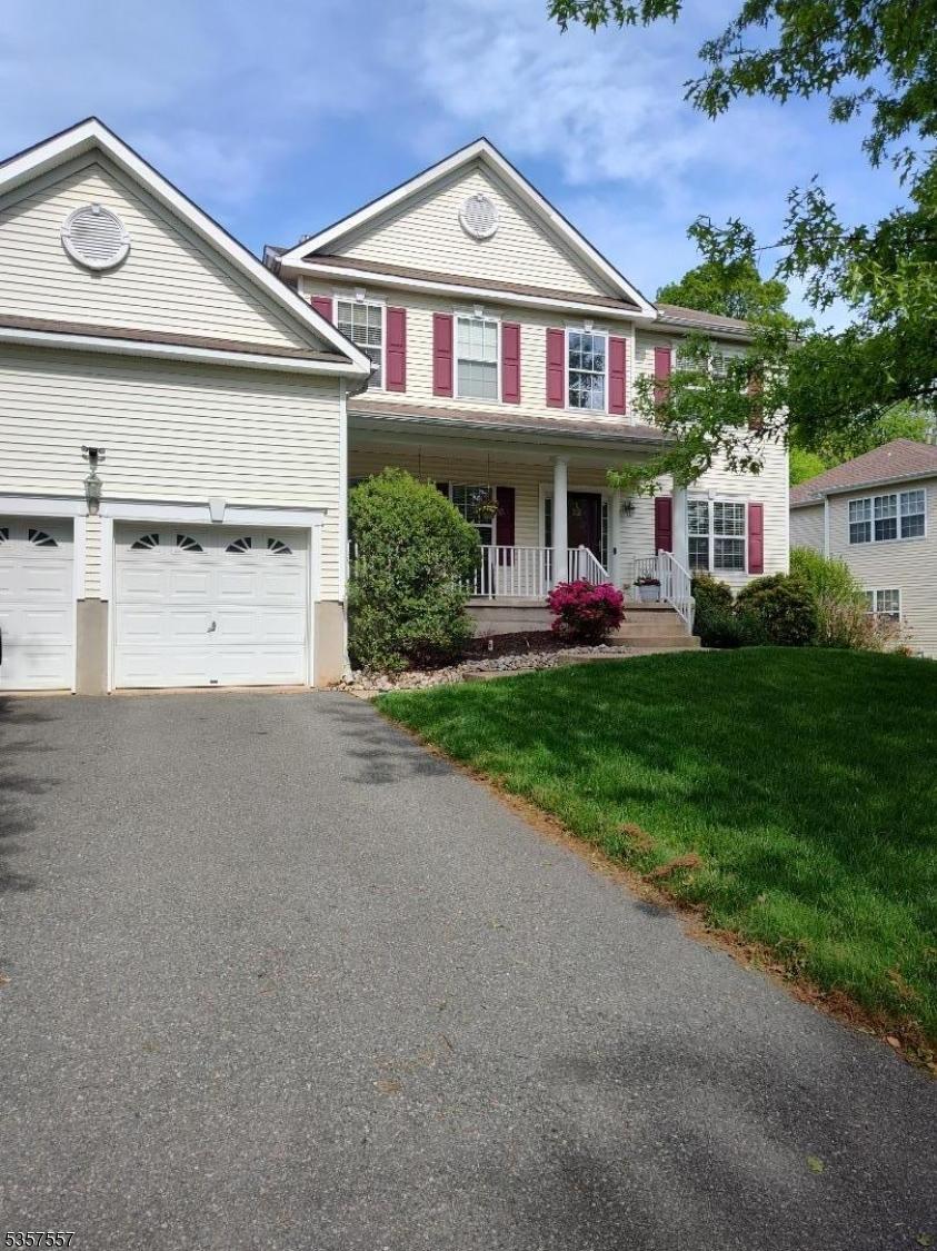 22 Hill Hollow Rd, Jefferson Twp, NJ 07849 - view of front of property with a front yard, driveway, and a porch
