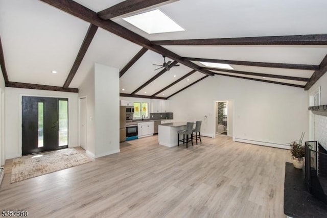 113 Spook Ridge Rd, Montague Twp, NJ 07827 - living room featuring a skylight, light wood-style floors, recessed lighting, baseboards, and baseboard heating