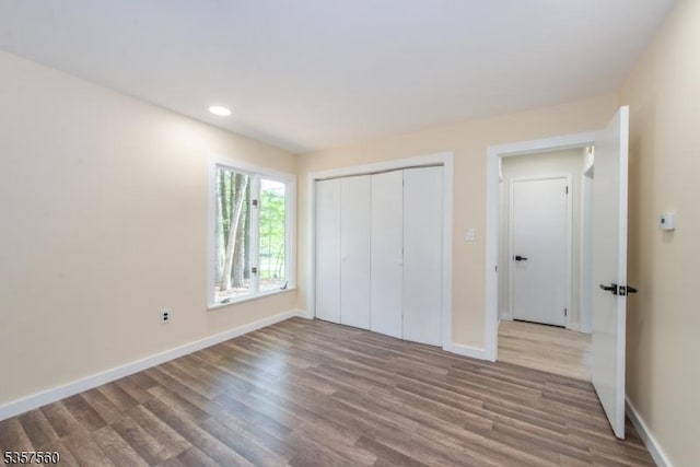 113 Spook Ridge Rd, Montague Twp, NJ 07827 - unfurnished bedroom with wood finished floors, baseboards, recessed lighting, and a closet