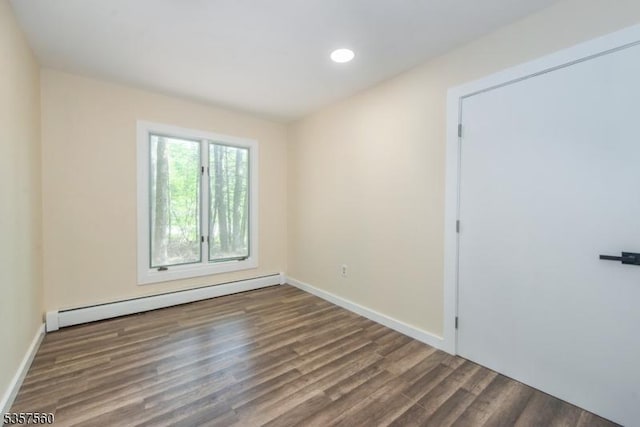 113 Spook Ridge Rd, Montague Twp, NJ 07827 - empty room featuring a baseboard heating unit, wood finished floors, and baseboards