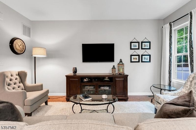 18 Brompton Pl, Randolph Twp, NJ 07869 - living room featuring baseboards and wood finished floors