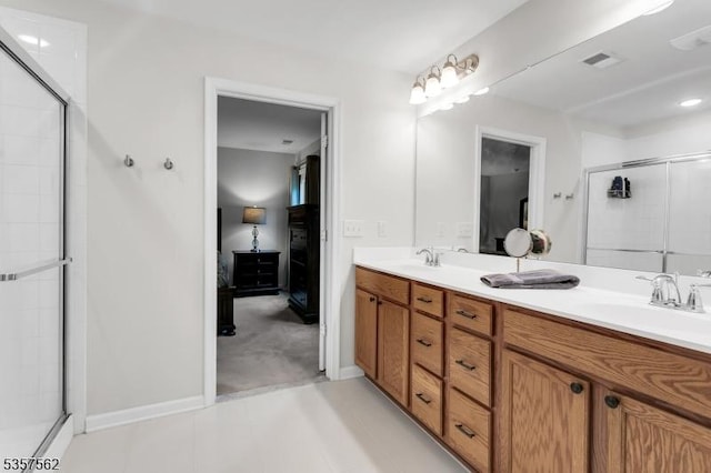 18 Brompton Pl, Randolph Twp, NJ 07869 - ensuite bathroom featuring double vanity, tiled shower, and baseboards