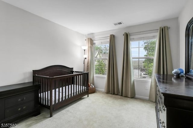 18 Brompton Pl, Randolph Twp, NJ 07869 - bedroom with light carpet, baseboards, and a crib