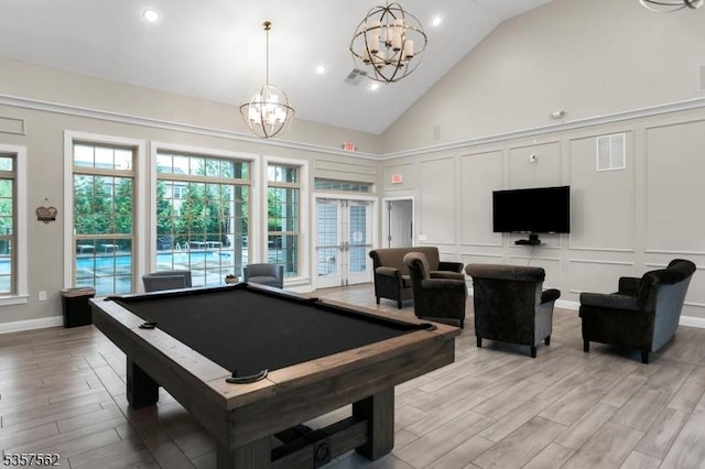 18 Brompton Pl, Randolph Twp, NJ 07869 - rec room with a decorative wall, a chandelier, light wood-style flooring, billiards, and high vaulted ceiling